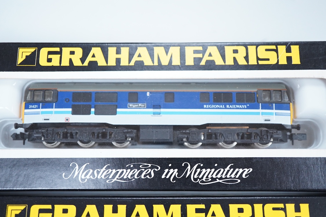 Four boxed Graham Farish N gauge railway diesel locomotives; a BR class 31, D5558 (8064), a Regional Railways class 31, Wigan Pier 31421 (8067), an EWS class 31, 31466, (806B) and a BR class 25, D7645 (8304).